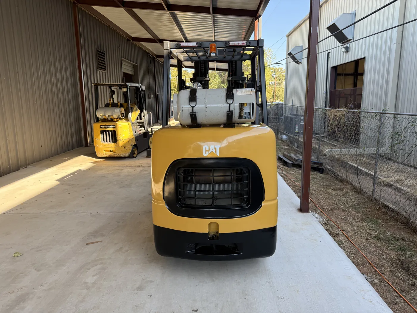 Same forklift rear after refurbishment, freshly painted with new decals