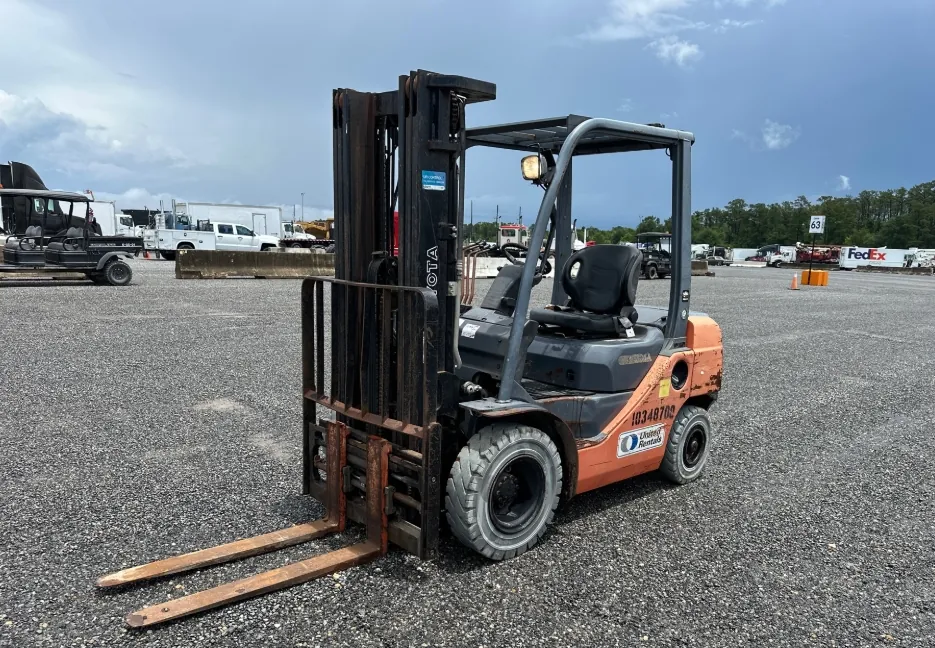 Toyota forklift before refurbishment, with rusted forks and worn paint