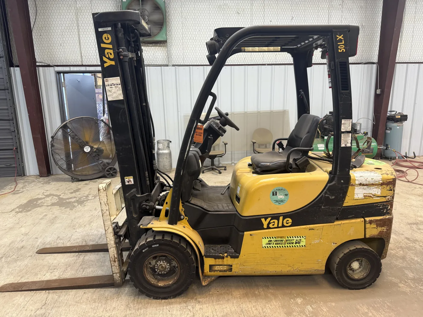 Yale forklift before refurbishment, with worn paint and rust
